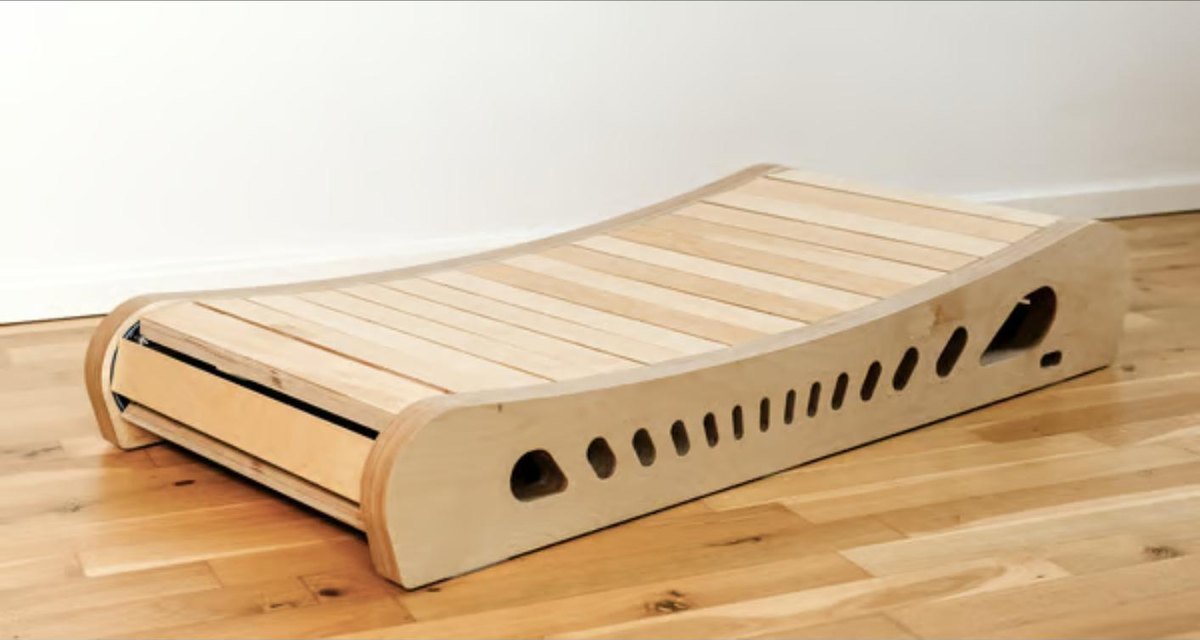 The curved wood frame of Office Walker seen from the side